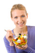 Young happy woman eating salad, isolated on white Young happy woman eating salad, isolated on white