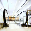 Enter to moving escalator in shopping center