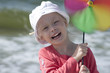 Smiling girl with pinwheel