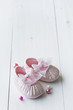 little girls baby shoes on a wooden floor, copy space for text