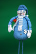 Blue snowman with red gift