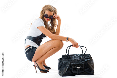 Attractive girl with sexy dress and big fashion bag