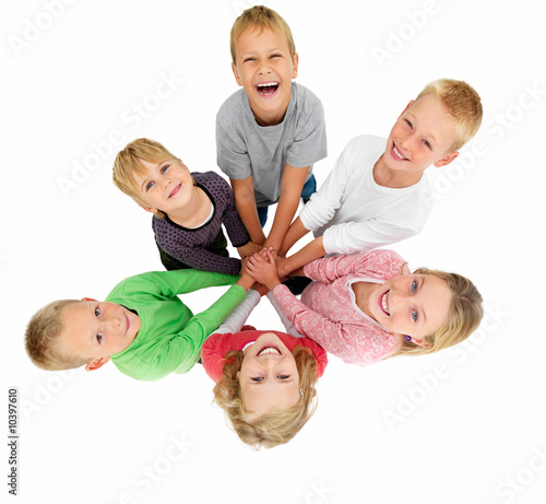 Circle of children holding hands showing togetherness