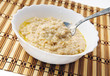 Hot morning porridge witn spoon.