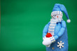 Blue snowman with gift