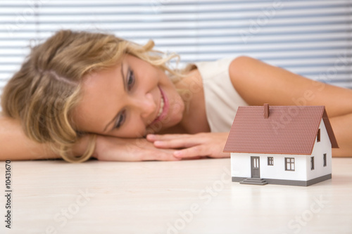 Photo: businesswoman with house for real estate concept businesswoman with house for real estate concept