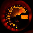 Accelerating sport-car speedometer closeup