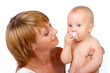 Baby and mother smiling. Isolated over white background.