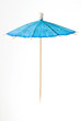 blue cocktail umbrella suspended in air. blue cocktail umbrella suspended in air.