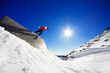 Snowboarder on wall ride with blue sky background