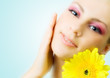 Beautiful woman with gerbera flower.