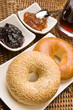 Fresh bagels with jam and blackcurrant juice