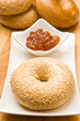 Fresh bagel with jam on a plate