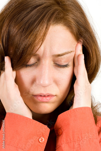 Photo: Young woman with migraine isolated on white background Young woman with migraine isolated on white background