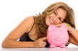 casual woman looking to save money in a piggy bank casual woman looking to save money in a piggy bank