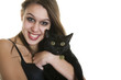 Goth girl holding a pure black cat.