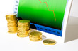 Foto: Market chart with declining graph and diminishing stack of money Market chart with declining graph and diminishing stack of money