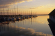 Austria, Burgenland, Boats moored at harbour, dusk