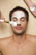 Germany, man getting a facial, close-up