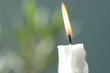 White candle burning, close-up