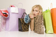 Blonde woman with shopping bags, portrait
