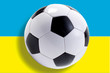 Soccer ball in front Ukraine of flag, close-up