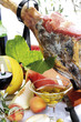 Serrano ham with olives and fruits, close-up, elevated view