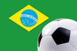 Soccer ball against Brazilian flag