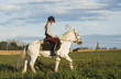 Girl riding pony