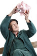 Old man with piggy bank
