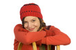 Young woman leaning on sledge, smiling, portrait