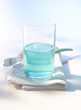 Tumbler, mouthwash, toothbrush, close up