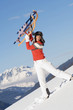 Woman in mountains with sledge