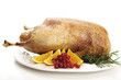 Roasted goose with oranges and red currants, close-up