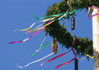 Austria, maypole wreath with pretzel and sausage, low angle view