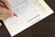 Man filling in form, close-up, elevated view