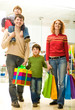Modern family going shopping in trade center