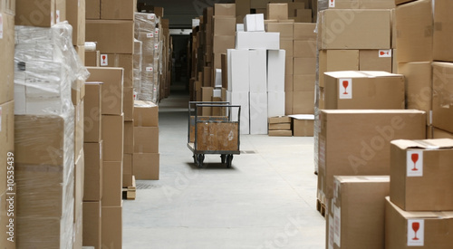Photo: warehouse corridor and handcart, carton stock warehouse corridor and handcart, carton stock