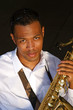 An young and trendy African-American sax musician