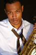An young and trendy African-American sax musician