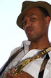An young and trendy African-American sax musician