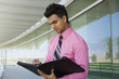 Businessman Writing in a Planner