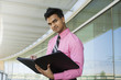 Businessman Writing in a Planner