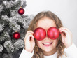 	Girl playing with Christmas decoration