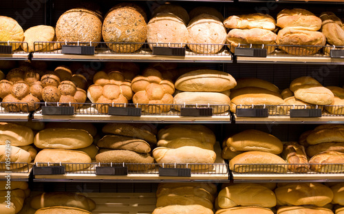 Photo: Various bread type on shelf. Bakery shop concept Various bread type on shelf. Bakery shop concept