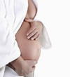Image of pregnant woman touching her belly with hands