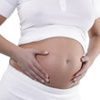 Image of pregnant woman touching her belly with hands
