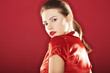 On red background girl with red lipstick - sexy portrait