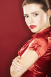 On red background girl with red lipstick - sexy portrait