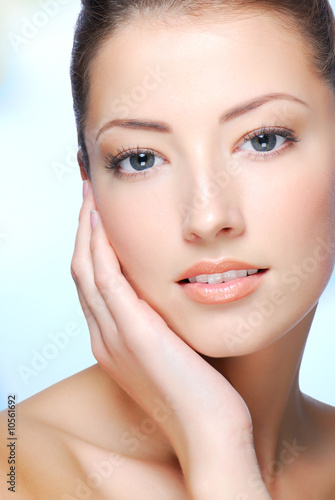 Portrait of young adult woman with health skin of face.